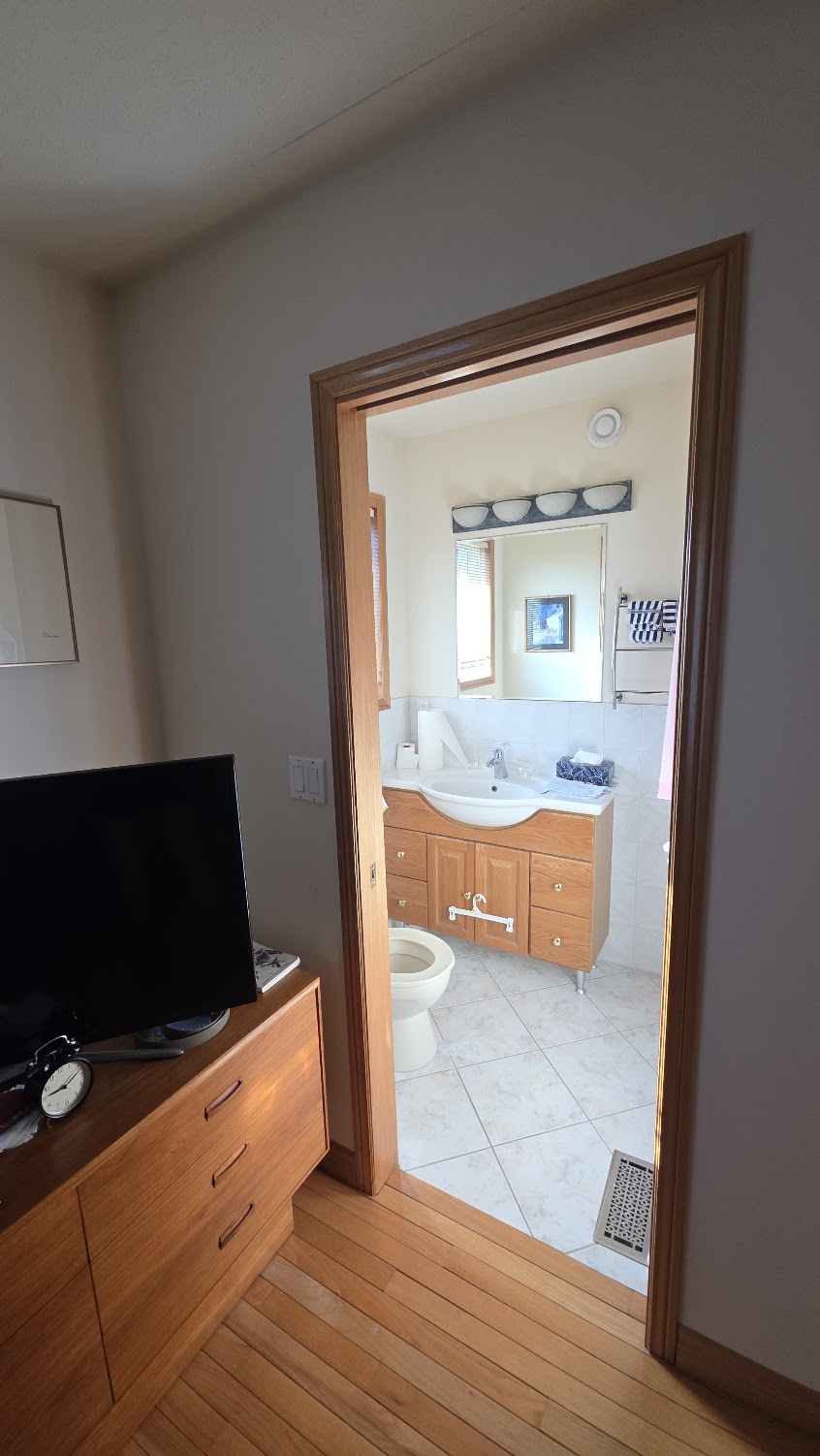 Second bathroom — entrance from the bedroom, standard doorway width